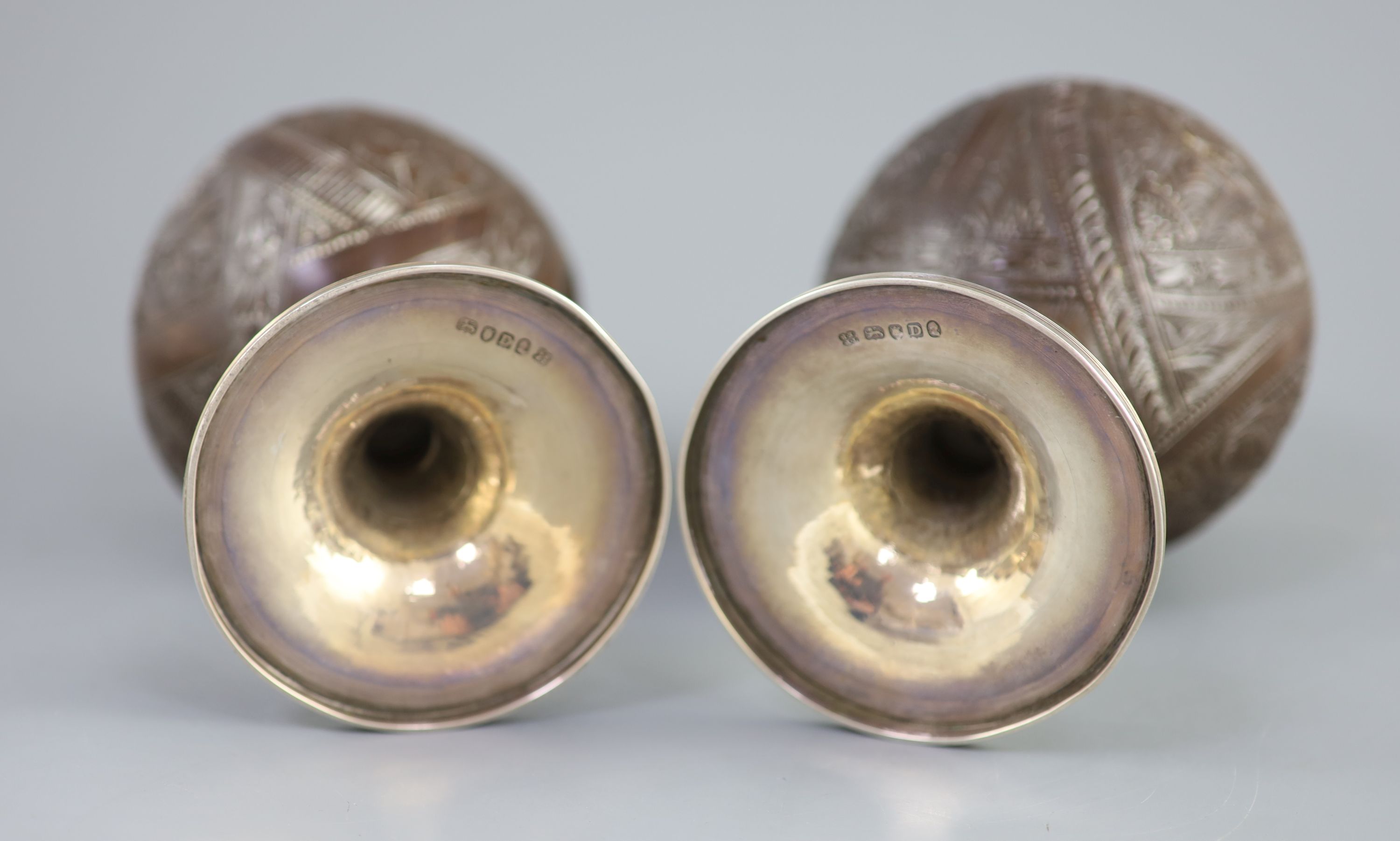 A pair of George III silver mounted coconut cups by Phipps & Robinson